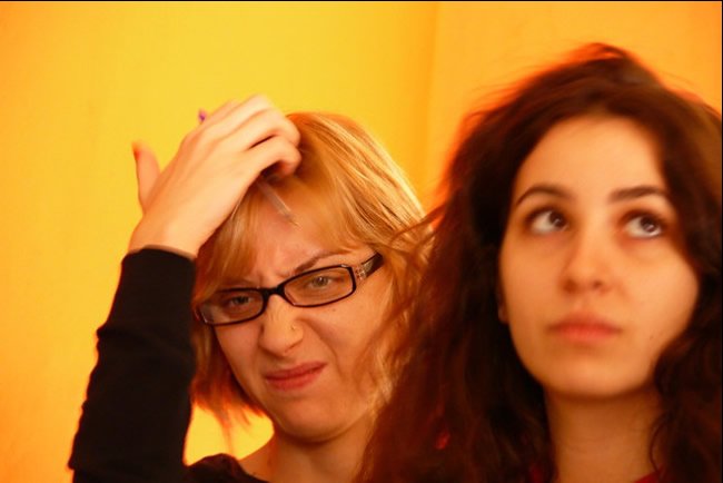 Confused woman scratching head