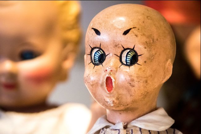 Vintage doll with surprised face