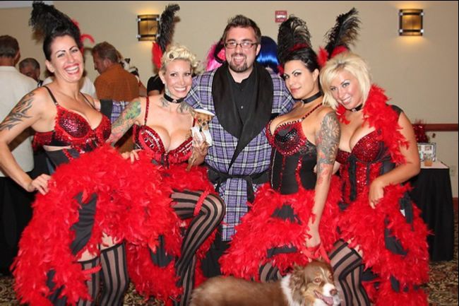 Man with many female admirers