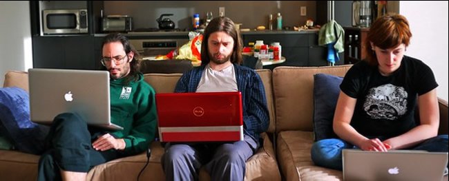 Young men playing on computers