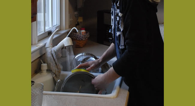 Woman washing dishes