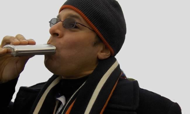 Man drinking from a flask