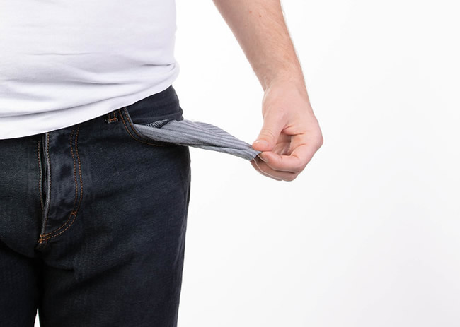 Man in jeans with empty pocket
