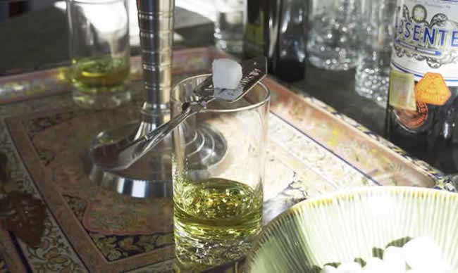 Glass of absinthe with sugar cube